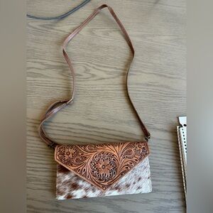 Brown cowhide tooled leather clutch/wristlet